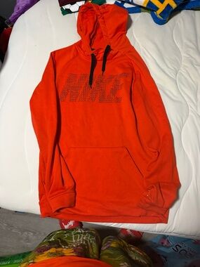 Nike Bright Orange Pullover Hoodie with Black Drawstrings
